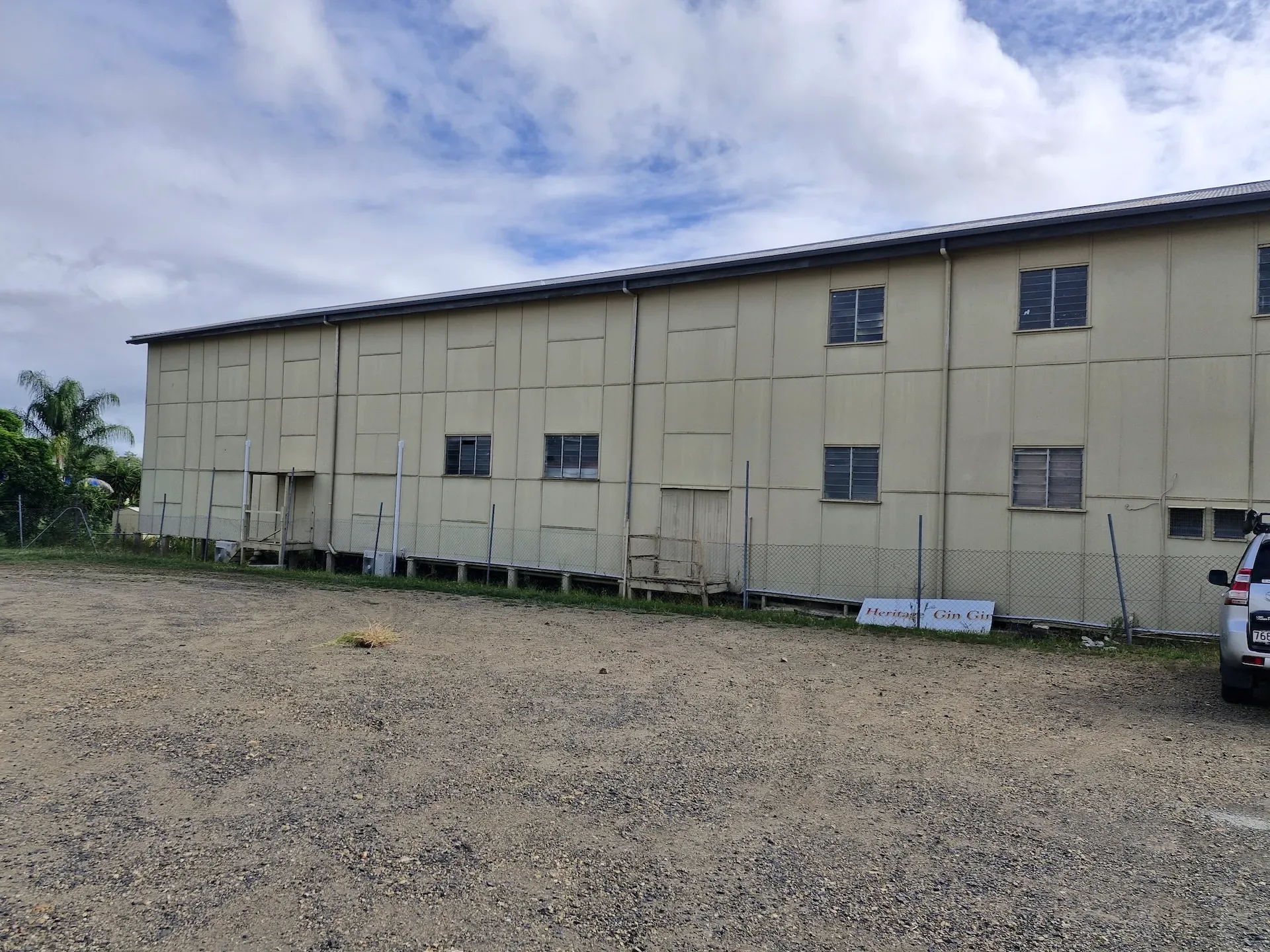 Large multi-storey building with an open gravel area in front