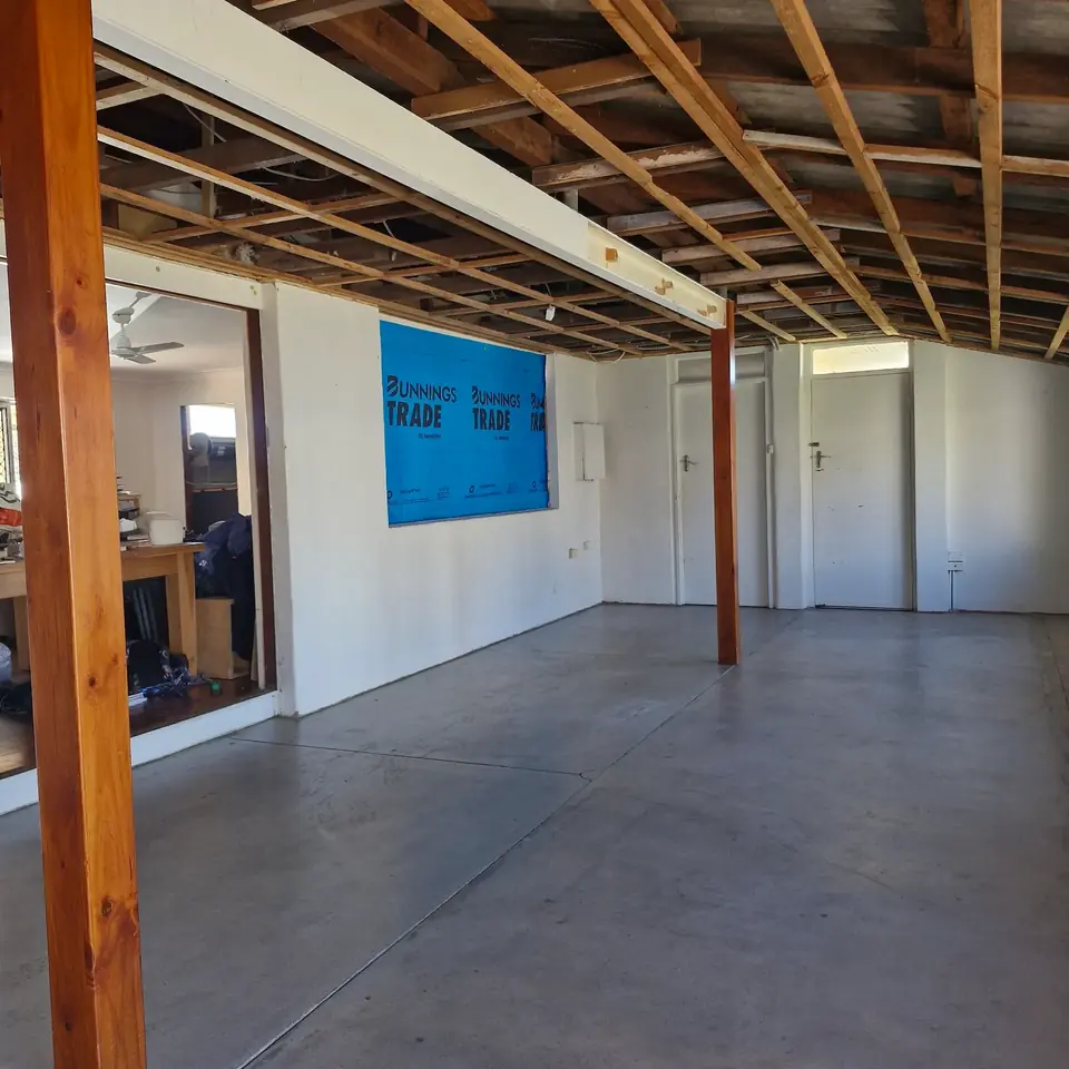 Large interior space stripped back to exposed ceiling framing and support posts